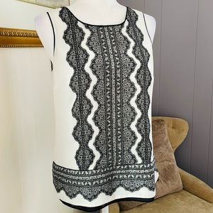 Sleeveless blouse with pretty faux lace print